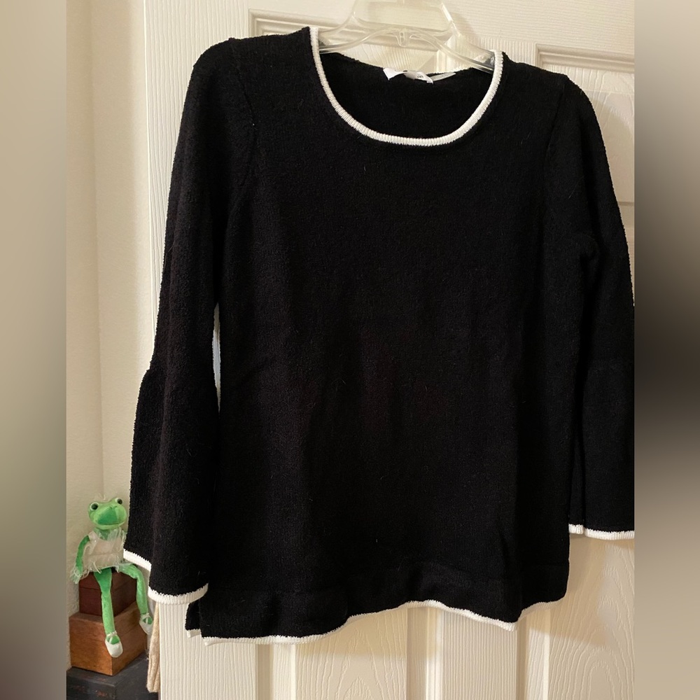 Calvin Klein sweater. Black with white trim. Sleeves flare at end.